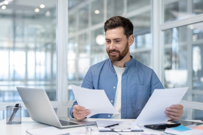 Business executive reviewing financial savings documents